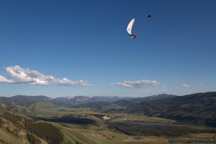 paragliding acro above green valley