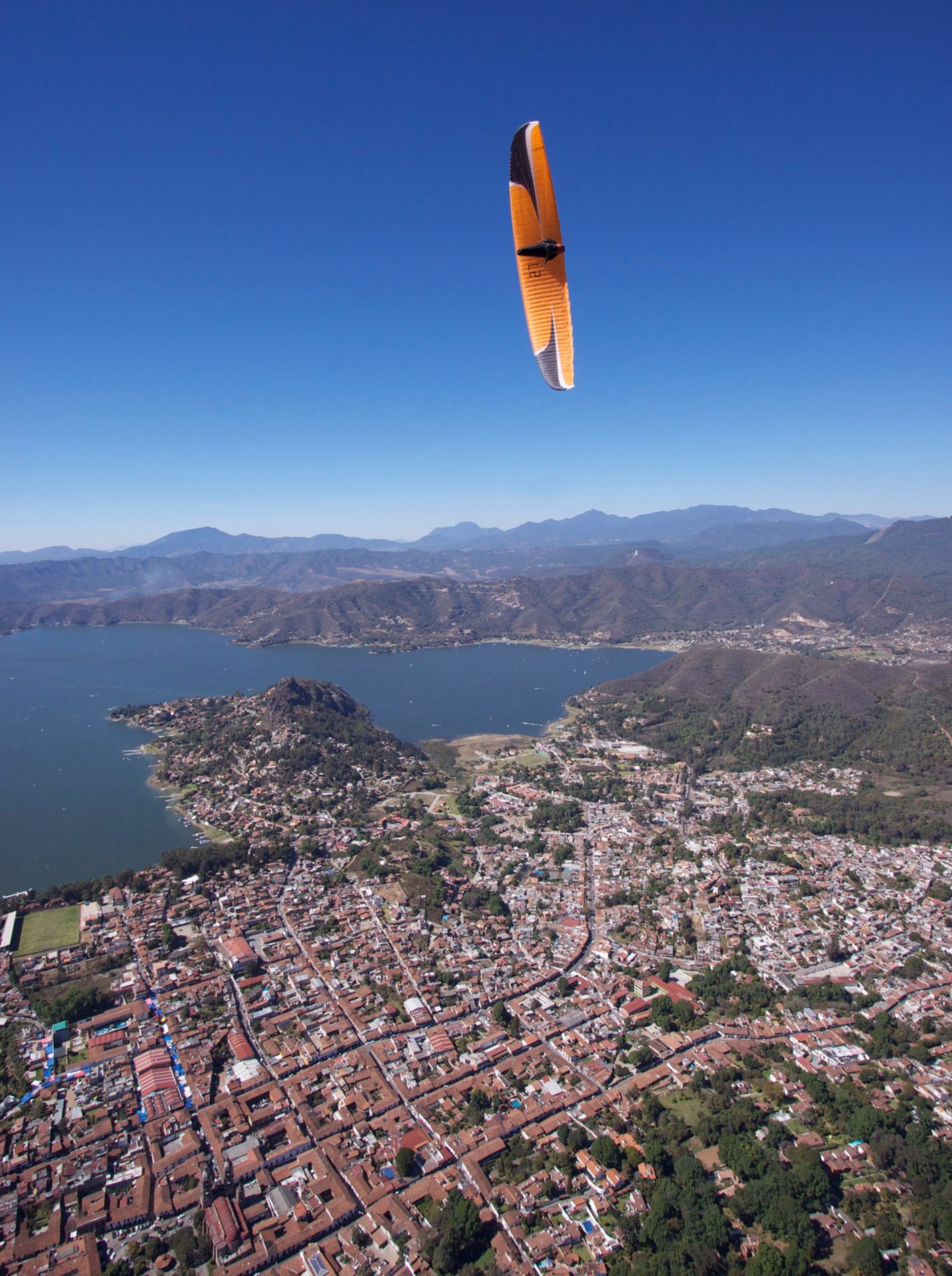 paragliding over city